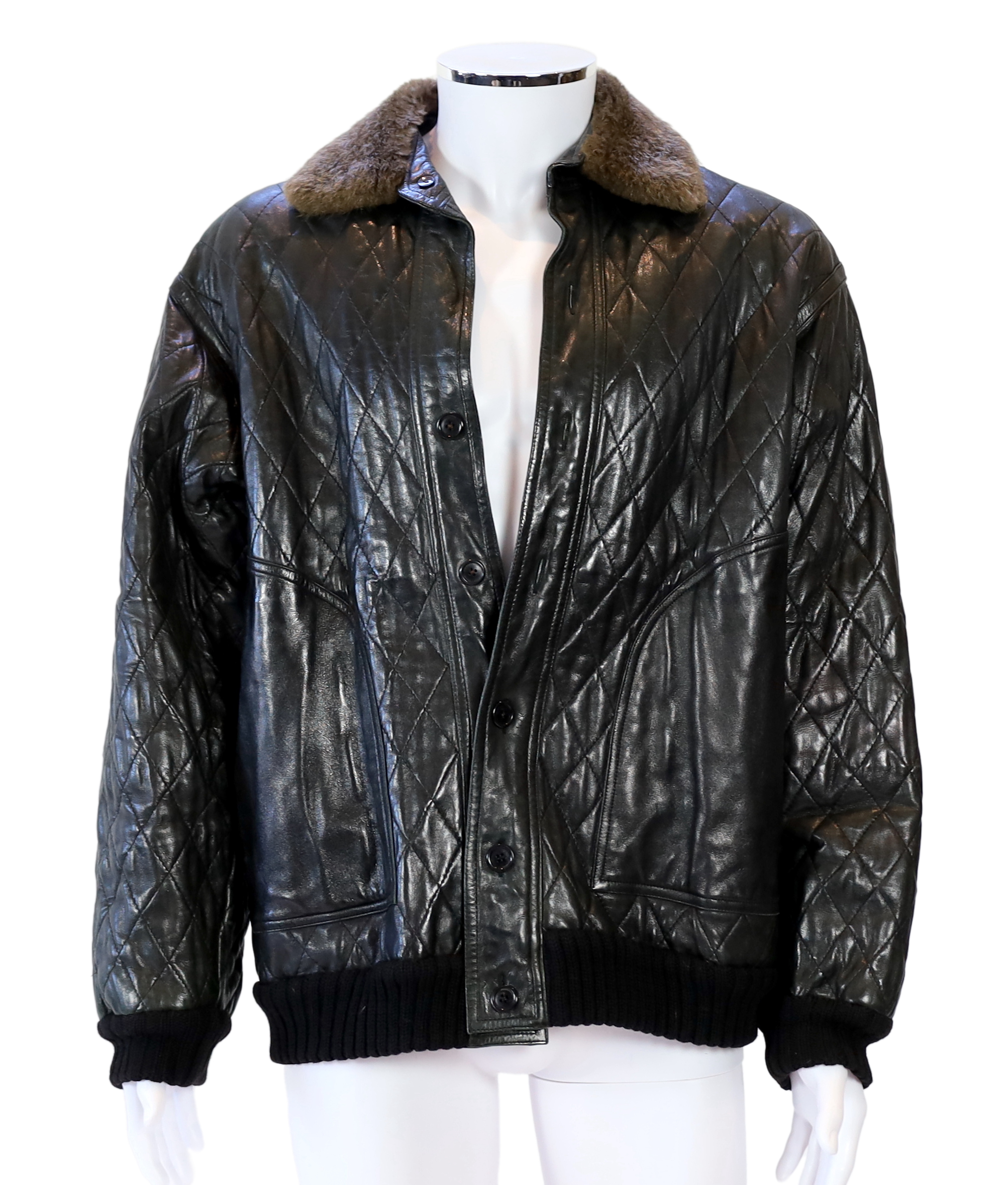 A Yves Saint Laurent Fourrures gentlemen's black quilted leather bomber jacket with fur collar and lining, approx size 42